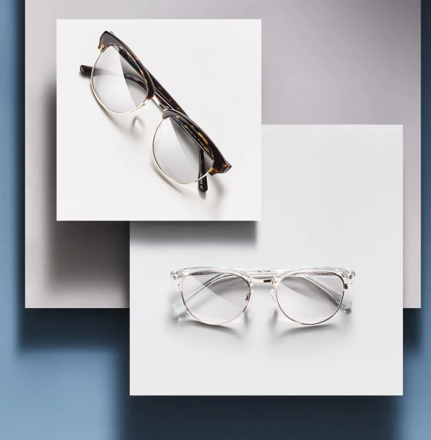 Still life featuring two pairs of eyeglasses with different frames, positioned on overlapping white squares against a gradient background.