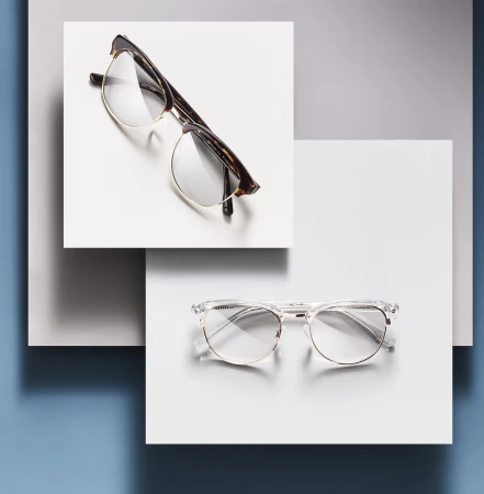 Still life featuring two pairs of eyeglasses with different frames, positioned on overlapping white squares against a gradient background.