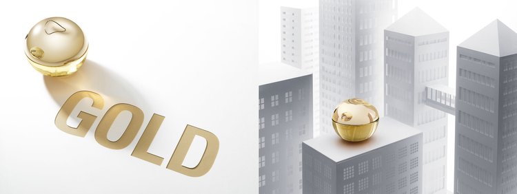 Two golden cosmetic jars on white surfaces, one with the text 'GOLD' beside it and a stylized building backdrop.