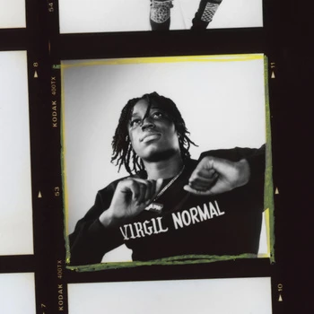 Headshot of a young Black man in a black sweater with white text; presented within a black and yellow film border against a white background.