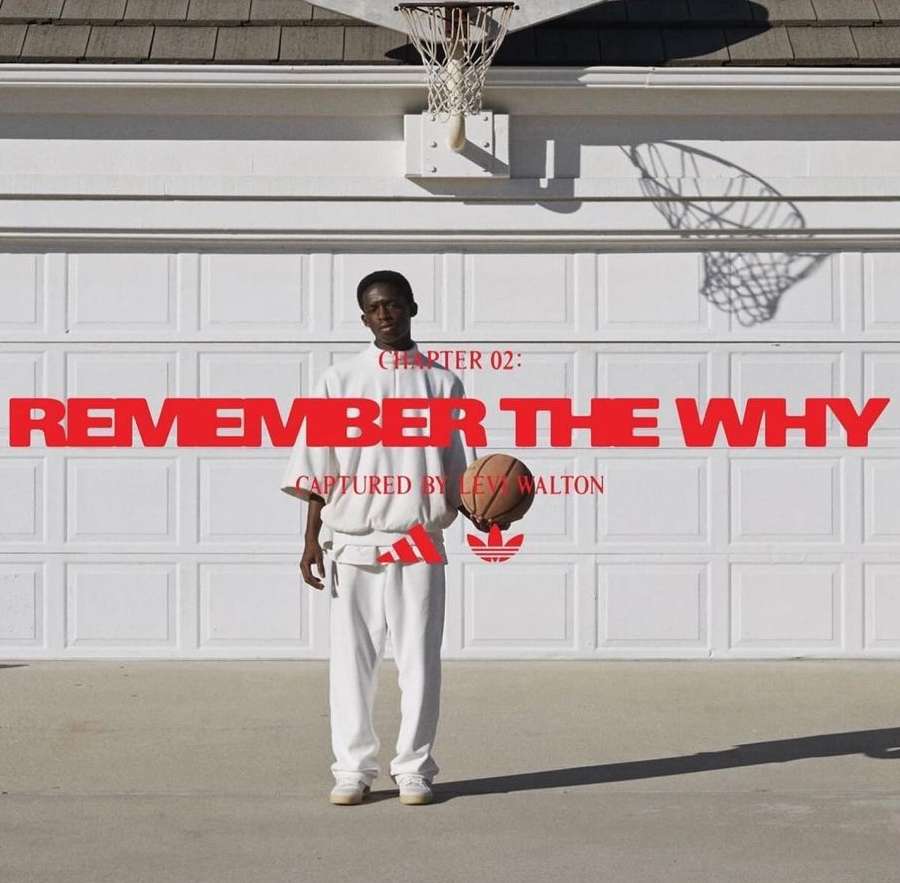A young Black man stands in front of a closed garage door holding a basketball, with the Adidas logo and graphic text overlays.