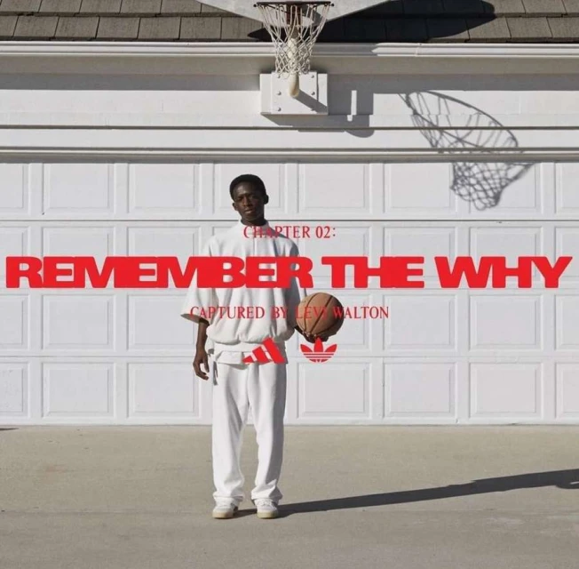 A young Black man stands in front of a closed garage door holding a basketball, with the Adidas logo and graphic text overlays.