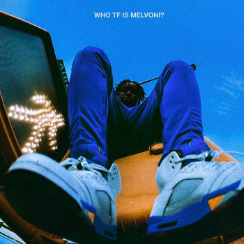 An upward angle features an adult wearing blue clothing and grey sneakers, reclining on yellow playground equipment against a blue sky.