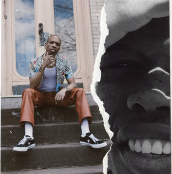 Young Black male fashionably dressed in patterned shirt and leather pants sitting on stoop, next to torn paper graphic.