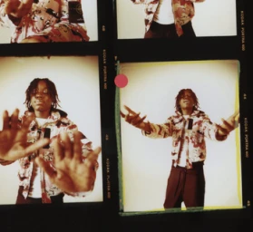 Contact sheet of medium-format film frames featuring a young Black man wearing a camouflage jacket against a plain background