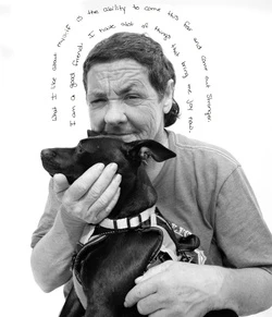 Monochrome portrait of a woman embracing a small dog, with handwritten text forming a halo around the subjects on a white background.