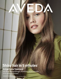 Close-up beauty portrait of a woman with long, glossy brown hair wearing a green top, photographed by Matthew Priestley.