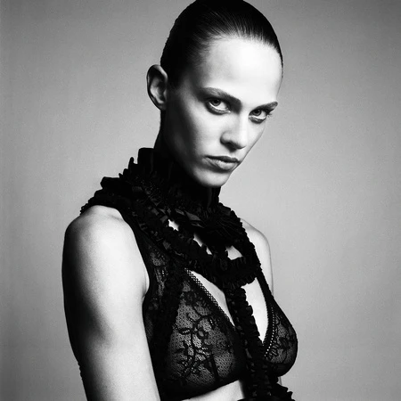 Portrait of a woman wearing a black lace high neck top photographed in monochrome by Nadya Wasylko.