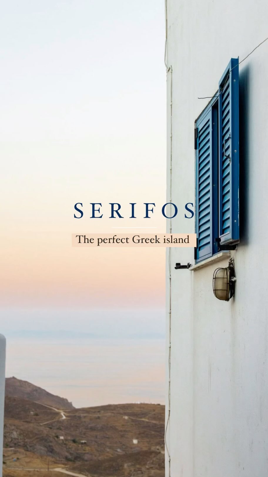 White building with blue shutters in Serifos, Greece overlooking the landscape with a sunset gradient sky in the background.