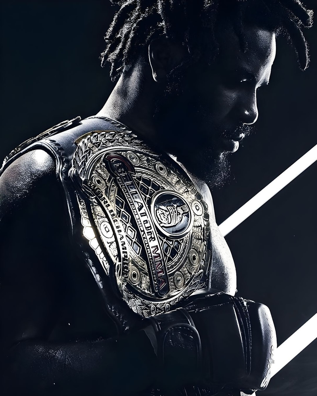 Close-up of a muscular adult male with dreadlocks wearing a championship belt and boxing gloves in a dramatically lit photo studio.