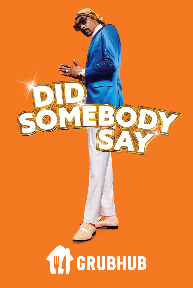 Snoop Dogg in a blue suit with white pants promotes Grubhub on an orange background, alongside a slogan in gold letters.