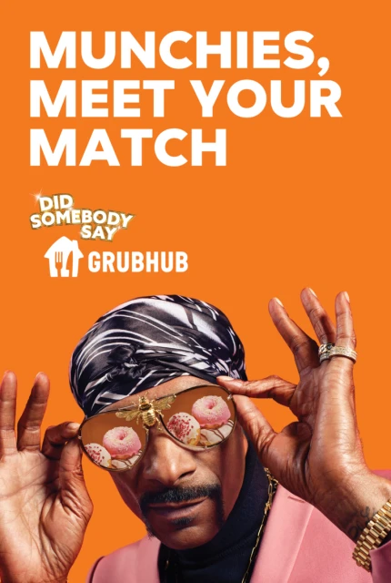 Grubhub ad featuring a Black man with sunglasses reflecting donuts, wearing a headscarf and pink jacket against an orange background.