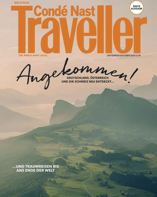 Condé Nast Traveller magazine cover featuring a scenic mountain landscape, showcasing verdant valleys and distant peaks, and magazine text.