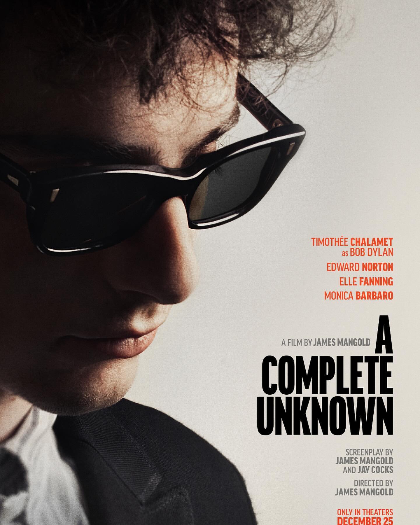 Movie poster featuring a close-up of a man with dark hair and sunglasses, accompanied by the title 'A Complete Unknown' and actor names.