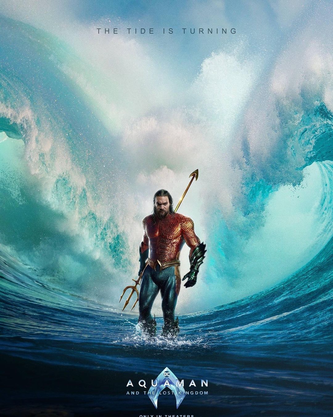 Movie poster for Aquaman and the Lost Kingdom features Jason Momoa as Aquaman standing in ocean waves with trident in hand.