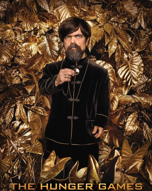 Portrait of Peter Dinklage as Tyrion Lannister, posing in a black velvet suit against a golden leaf background in a promotional still.