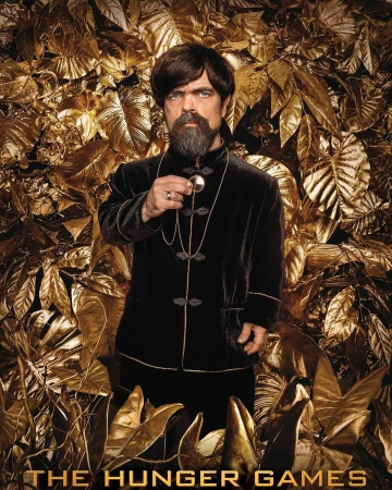 Portrait of Peter Dinklage as Tyrion Lannister, posing in a black velvet suit against a golden leaf background in a promotional still.