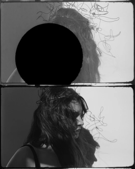 Monochrome portrait of a woman in a bustier with artistic scribbles and a dark circle obscuring the top part of the image.