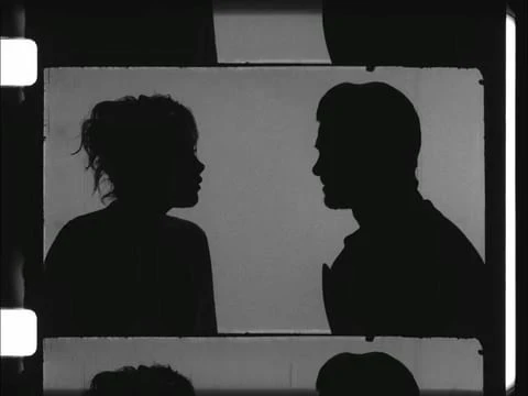 Silhouetted profiles of an adult male and female facing each other within a film frame, rendered in black and white.
