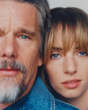 Close-up portrait of Ethan Hawke and Maya Hawke together wearing denim jackets against a plain white background