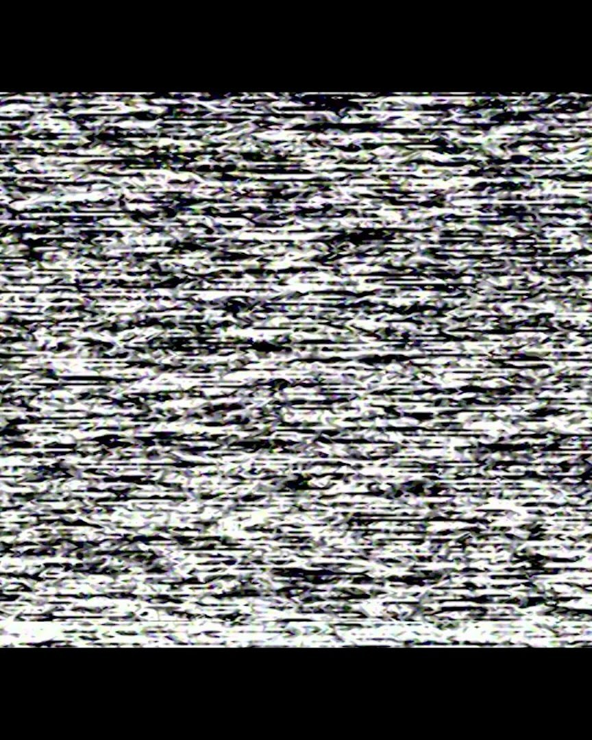 Image of digital static noise pattern with black background.
