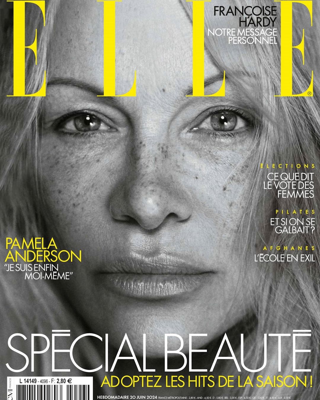 Elle magazine cover featuring a close-up portrait of Pamela Anderson, showcasing her freckled skin and natural appearance in black and white.