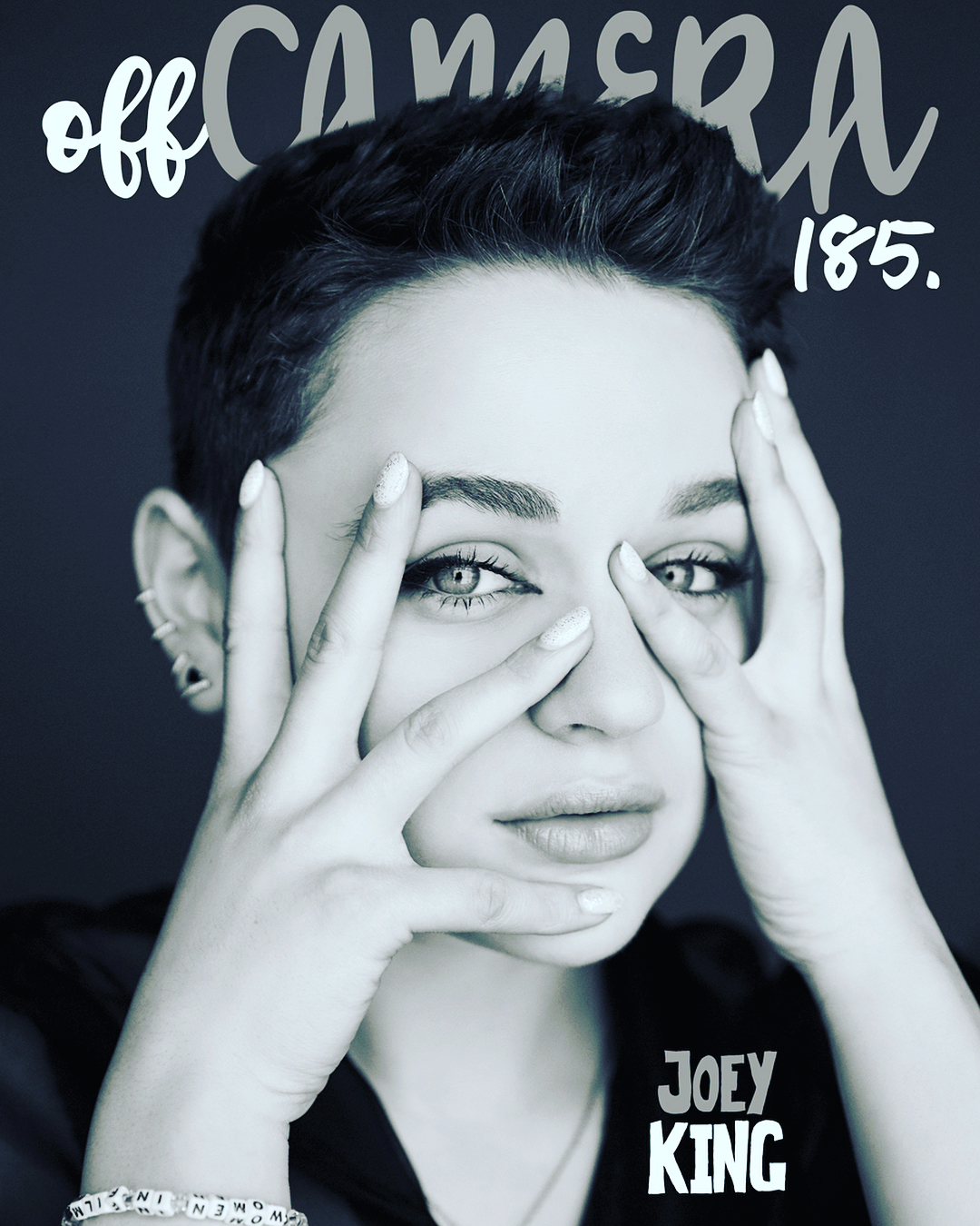 Close-up portrait of a young woman with short hair, hands framing face, with Off Camera magazine text overlay against a dark grey background.