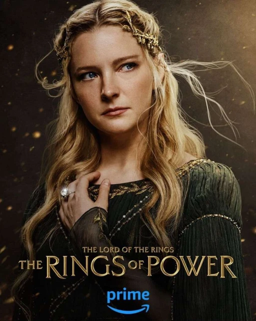 Portrait of a light-skinned woman with long blonde hair and a jeweled headband, wearing a green dress with gold trim, movie poster.