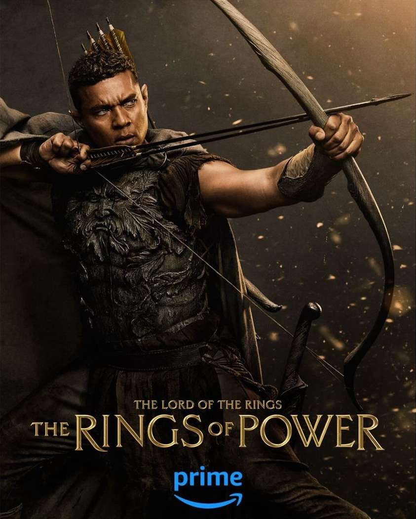 Poster of a dark-haired man with an archer's bow and wearing armour with a leafy design for The Lord of the Rings: The Rings of Power.