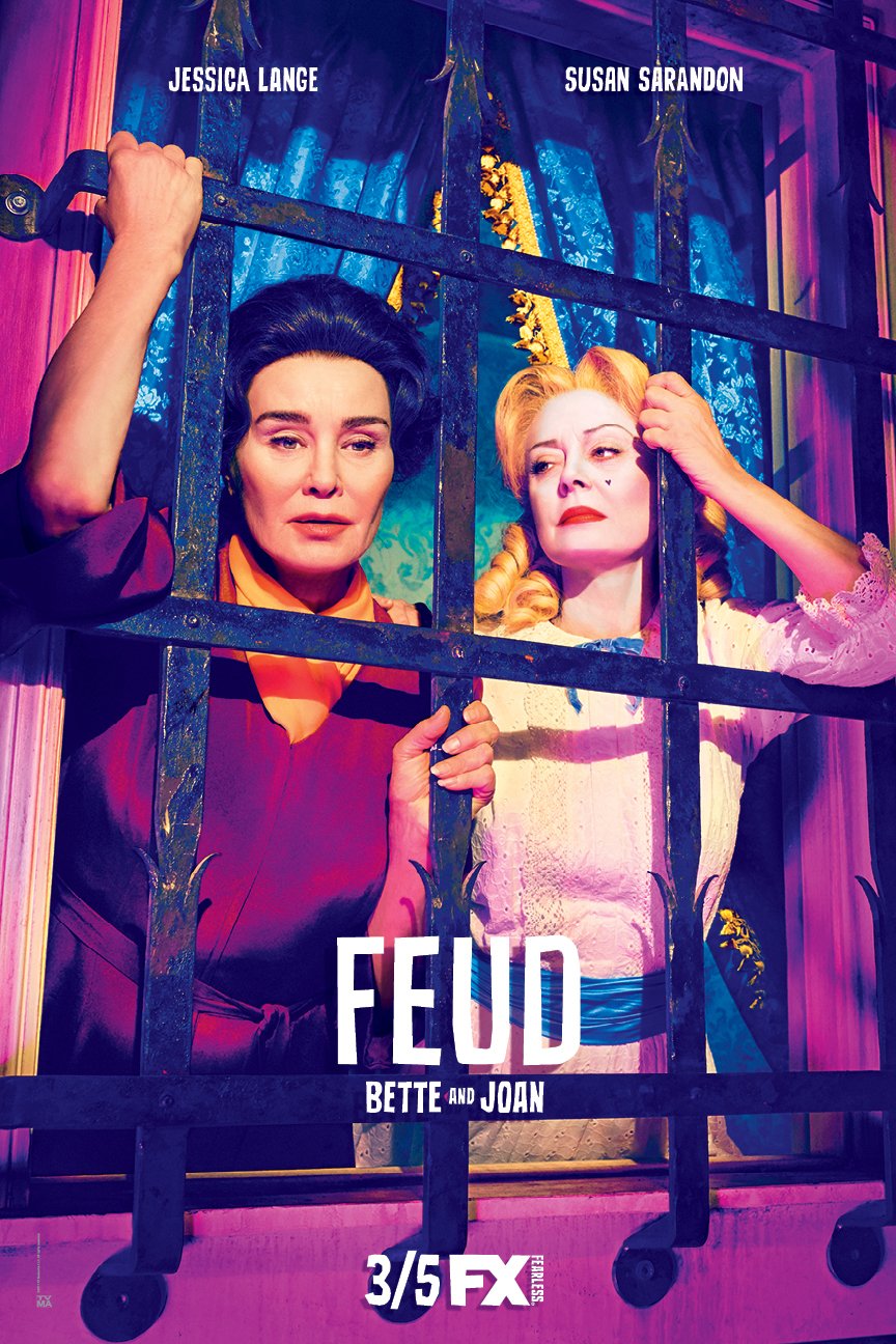 Two adult females, Jessica Lange and Susan Sarandon, behind bars in an indoor setting with the title of FEUD on the bottom.
