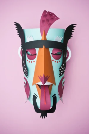 Handmade paper mask art with a light blue base, orange nose, dark pink accents, and a black headdress on a pink background.