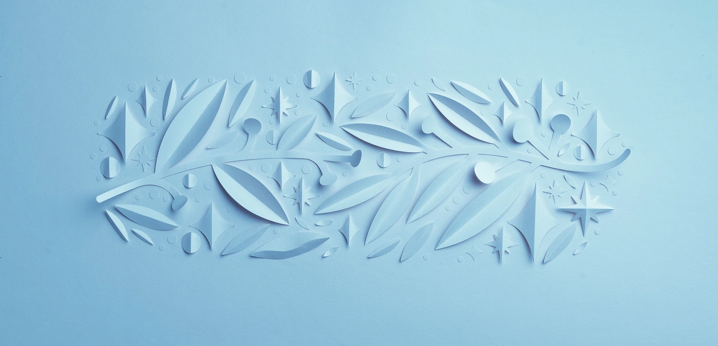 Light blue paper cut relief of botanical leaves, branches, stars, and geometric shapes against a matching pastel blue background.