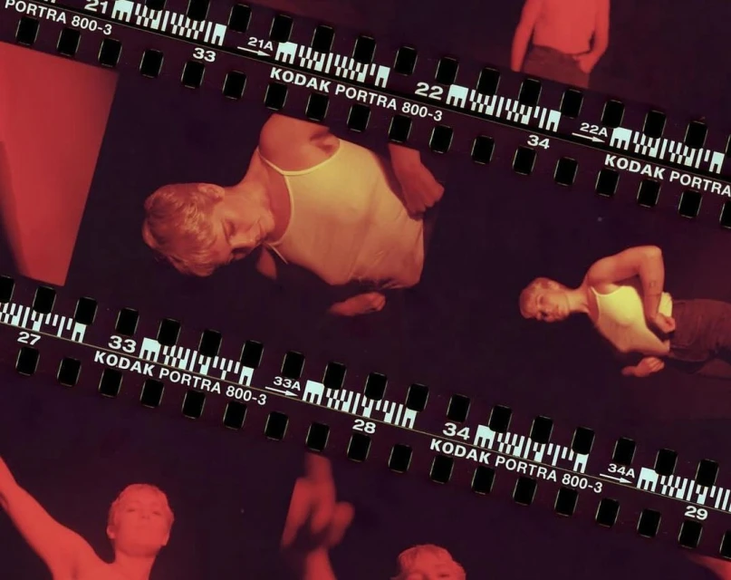Multiple exposures of a light-skinned adult posing in a tank top, overlaid with Kodak film strips, creating an artistic, multi-layered effect.
