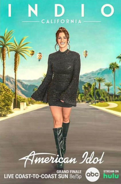An adult woman stands on a desert highway in front of palm trees in a sparkling black dress and black boots, promoting American Idol.