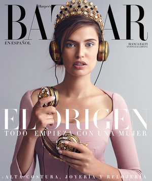 Magazine cover featuring Bianca Balti with gold headphones and a jeweled crown, Harper's Bazaar logo visible.