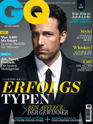 Magazine cover featuring a man in a suit and tie against a grey backdrop, with GQ logo and various headlines in German.