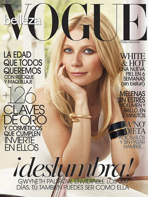 Vogue magazine cover featuring Gwyneth Paltrow with blonde hair and blue eyes, wearing a white top and gold bracelet with natural window light.