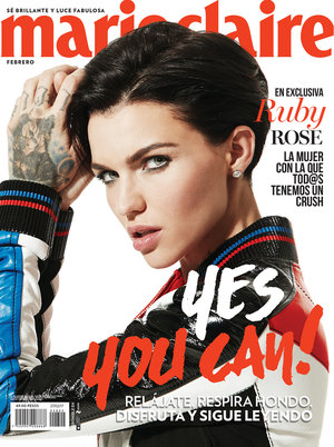 Marie Claire cover featuring Ruby Rose with short dark hair, tattoos, wearing a black and blue jacket on a white background.