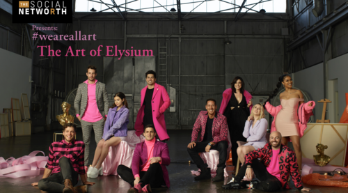 Group of nine people in a warehouse, wearing bright pink accents, seated and standing around art supplies, including a golden bust and ribbons.