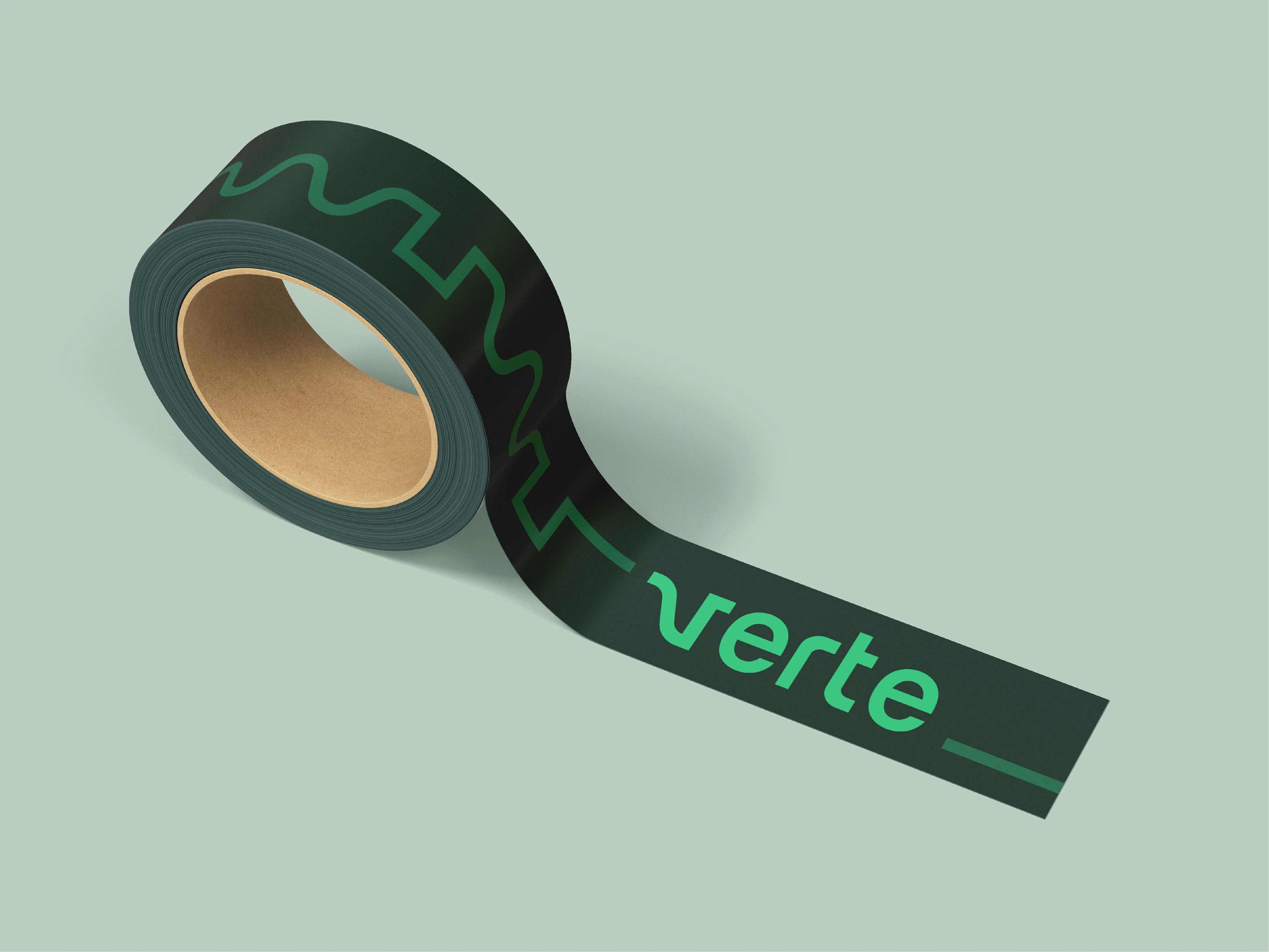 Roll of dark green tape with a geometric pattern and the word 'verte' on light green background, product mockup, design resource.