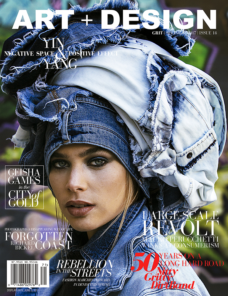 Magazine cover featuring a woman wearing a denim headpiece and jacket against a muted background with the words 'Art + Design'.