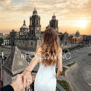 Woman in white dress overlooking Mexico City Metropolitan Cathedral at sunset, held hand point-of-view shot, golden hour.