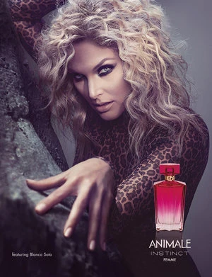 A fashion and beauty advertisement featuring a blonde woman wearing a leopard print top with a bottle of perfume to the right.