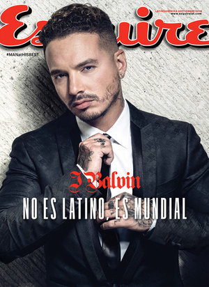 Esquire cover featuring J Balvin in a dark suit, shot in a photo studio with red and white logo on a neutral background.