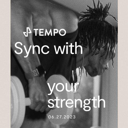 Black and white shot of an adult male lifting a dumbbell; fitness and strength training concept for Tempo workout program.