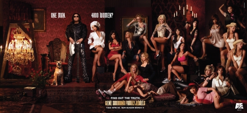 Advertisement featuring one man standing among a large group of women, along with a dog, set in a room with dark, opulent decor.