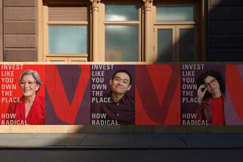 Outdoor advertising mural featuring portraits of three diverse individuals alongside investment messaging, set against a tan building facade.