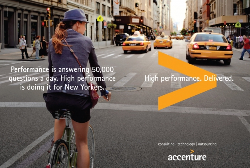 Woman rides bike in a city street with yellow cabs, as part of an Accenture ad campaign with the tagline "High performance. Delivered."
