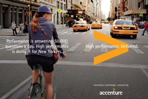 Woman rides bike in a city street with yellow cabs, as part of an Accenture ad campaign with the tagline "High performance. Delivered."