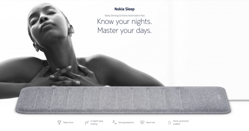 Black and white advertisement featuring a woman resting with eyes closed above a grey sleep tracking pad by Bryce Duffy